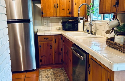 Seguin House | Fika on The Guadalupe- a charming RIVERFRONT retreat that sleeps 13.