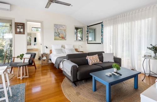 Bellbrae Apartment | Fireside Bliss Poolside Escape with Cosy Comforts