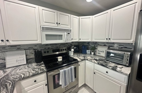 Heron Harbour Isle Condo | First Floor 3BR/2BA Waterfront Condo w/Pools! Discount and linens for 7 nights!