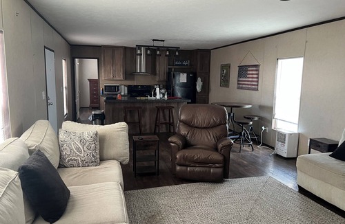 Hackberry House | Fishing camp with boat stall cleaning table three bedroom two bath