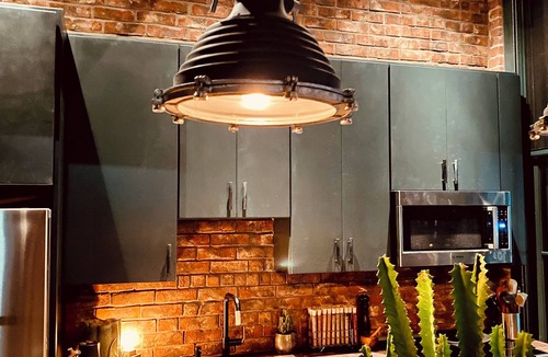 Fort Point Apartment | Fort Point Corner of Windows brick & beam loft