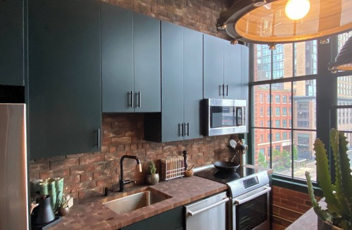 Fort Point Apartment | Fort Point Corner of Windows brick & beam loft