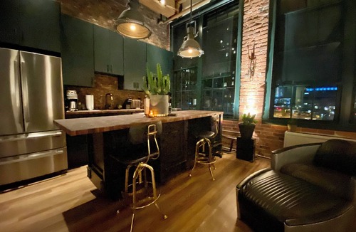 Fort Point Apartment | Fort Point Corner of Windows brick & beam loft