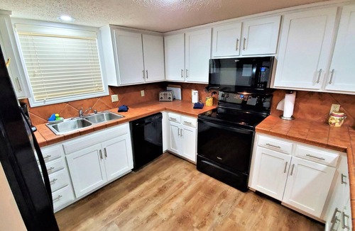 Holiday Island Condo | Four-bedroom condo with three KING BEDS, two twin beds. Three full baths.