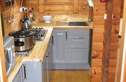 Saint-Germain-de-Tallevende-la-Lande-Vaumont Ski Chalet | Traditional Log Cabin on quiet Residential Commune overlooking Lake Dathee