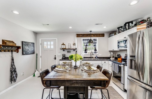 Wichita House | Front door parking, private covered patio with fenced in backyard