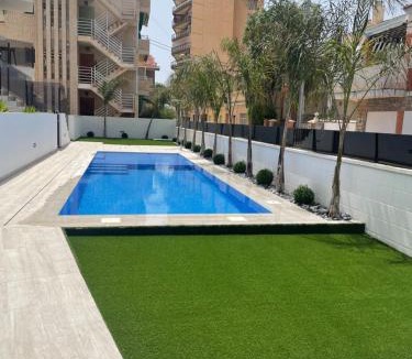 Santiago de la Ribera Apartment | Frontsea Beach bungalow with swiming pool and long terrace