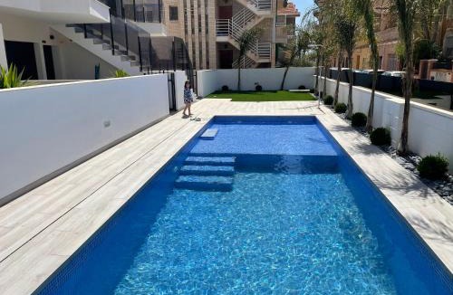 Santiago de la Ribera Apartment | Frontsea Beach bungalow with swiming pool and long terrace