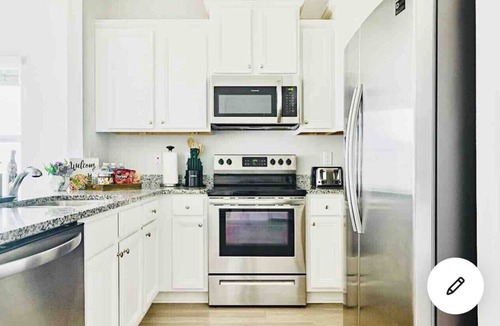 Upper Grand Lagoon House | Game Room, mins to beach, Pier Park and Sports Complex, POOL, pond view