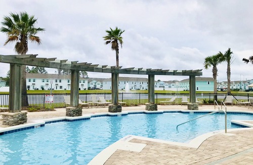 Upper Grand Lagoon House | Game Room, mins to beach, Pier Park and Sports Complex, POOL, pond view