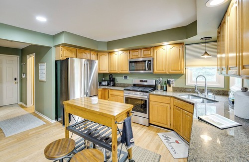 Commerce Township House | Game Room & Fire Pit: Canal-Front Commerce Home