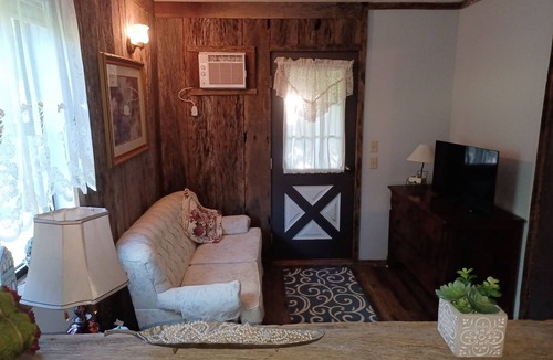Claremore Cottage | Garden Room and Living area/Kitchen downstairs