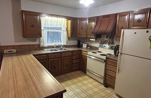 Taberg House | Glenmore Creek, ranch style home located on 10, mostly wooded, private acres.