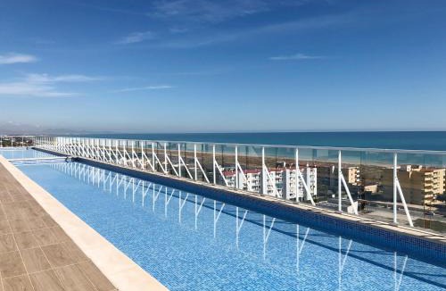 Canet de Berenguer Apartment | Global Vacacional, Moderno apartamento con piscina y terraza en la playa de Canet
