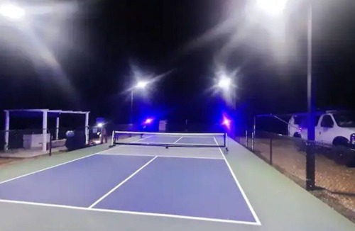 Auburn RV Rental | Glow in the dark Pickleball and Glamping in 16x14 canvas tent with Queen setup