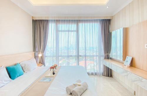 Cikini Apartment | Good and Relaxing 2BR at Menteng Park Apartment By Travelio