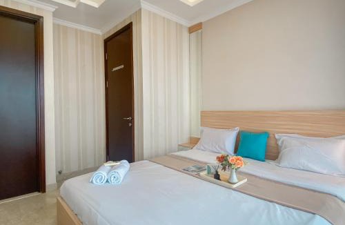 Cikini Apartment | Good and Relaxing 2BR at Menteng Park Apartment By Travelio