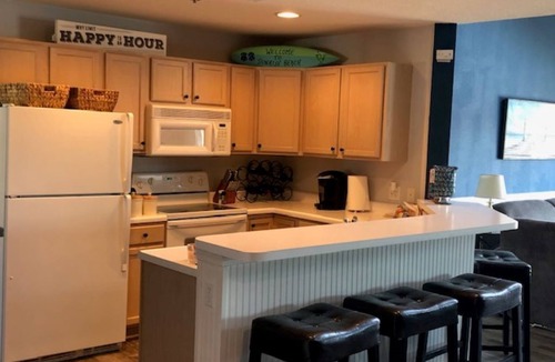 Sunrise Beach Condo | Gorgeous Lakeview Balcony Condo with 4 BDRM/3BA and Heated Pool