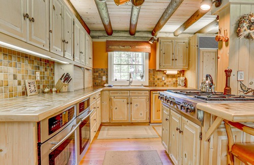 Trout Lake House | Gorgeous Riverfront Home & Guesthouse with Deck, Firepits & Media Room