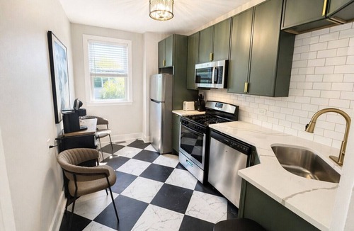 Lakeview Apartment | Gothic-meets-mid-century 2BR in Lakeview | Statment Kitchen + Dining for 4