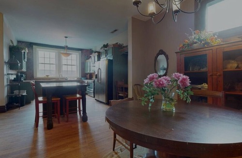 Portsmouth Apartment | Grab a latte at the coffee shop downstairs, then walk a block to the floodwall where you'll find 2000 feet of murals showcasing the history of Portsmouth. After that, walk back up 2nd Street and check out the antique shops and local restaurants.