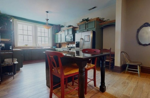 Portsmouth Apartment | Grab a latte at the coffee shop downstairs, then walk a block to the floodwall where you'll find 2000 feet of murals showcasing the history of Portsmouth. After that, walk back up 2nd Street and check out the antique shops and local restaurants.