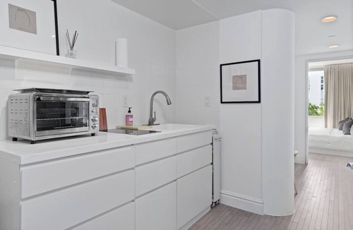 West Avenue Apartment | Grand Suite with Private Balcony, Pool, and Gym