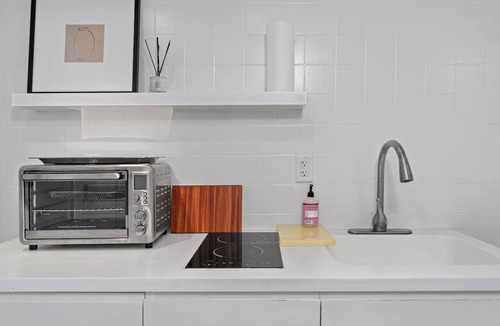 West Avenue Apartment | Grand Suite with Private Balcony, Pool, and Gym