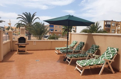Los Nietos Apartment | Ground floor apartment, free wifi, satellite tv, BBQ, communal pool