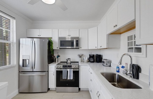 Bay Esplanade Condo | 🌴 Ground Floor Condo @ Clearwater Beach Suites | Steps to Sand Heated Pool ➠ CBS 102