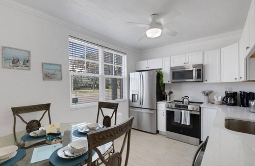 Bay Esplanade Condo | 🌴 Ground Floor Condo @ Clearwater Beach Suites | Steps to Sand Heated Pool ➠ CBS 102