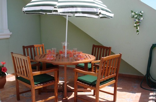 Los Arenales del Sol Apartment | Ground floor corner apartment with WIFI, spacious sunbathing area and pool views