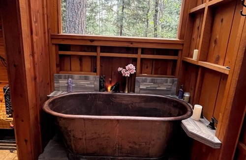 Rough and Ready Apartment | Handcrafted Roundhouse studio & loft. Large sky window + private outdoor shower
