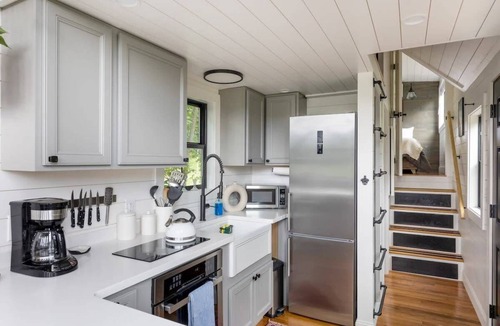 Johnson House | Haven Tiny House w hot tub on river near Stowe