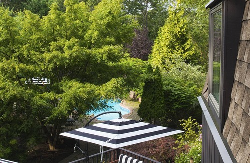 Hampton Bays House | Hexagon shape cottage with pool & koi fish pond