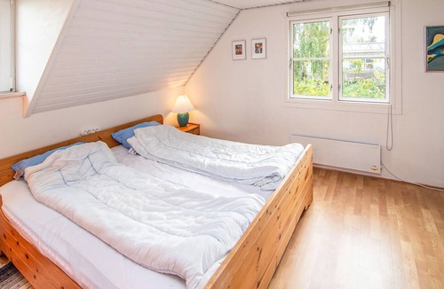 Hjarbæk House | High up, with a fantastic view of the fjord, is this beautiful cottage that provides the setting for