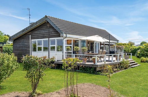 Roskilde House | Highly furnished wooden house with wood-burning stove, fjord view and boat dock.