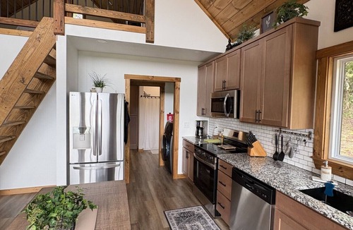 Harrison Cabin | Hilltop Forest View with Large Windows, Covered Deck, & Private Hot Tub for Two!