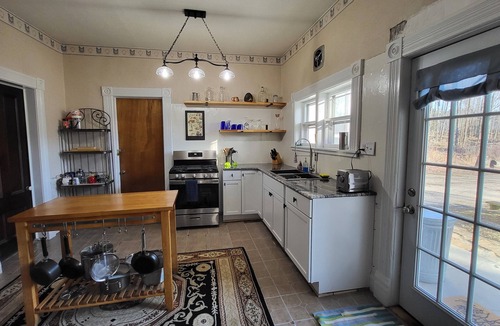 South Colton House | Historic 1840's home on Raquette River with creek, large lawn, view of waterfall