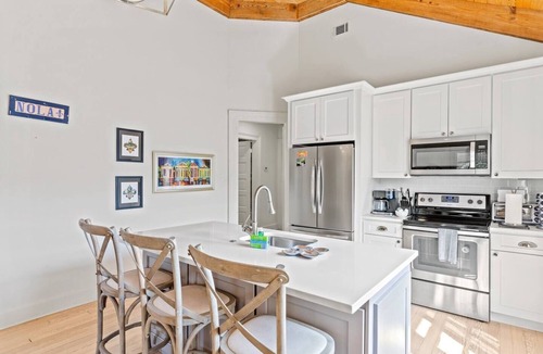 Uptown Historic District Apartment | Historic 3BR on Magazine St with front & rear balconies. Walk to cafés, quick ride to FQ & Dome.