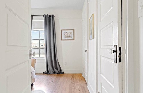 Uptown Historic District Apartment | Historic 3BR on Magazine St with front & rear balconies. Walk to cafés, quick ride to FQ & Dome.
