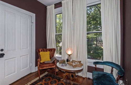 Historic Montford Cottage | Historic Cottage Retreat walk to downtown porch swings cozy fireplaces