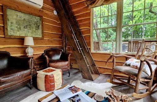 Dennis Cabin | Hobbit Treehouse with Waterfall on the Brazos River for Glamping in Texas