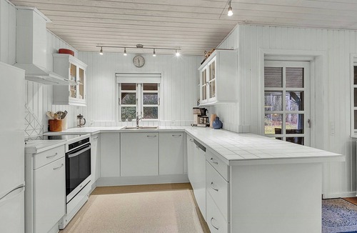 Bjerringbro House | Holiday home by Gudenå River with natural garden