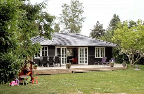 Dronningmolle House | Home among trees with architectural flair