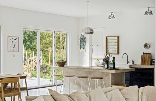 Rrvig House | Home with panoramic windows and stones