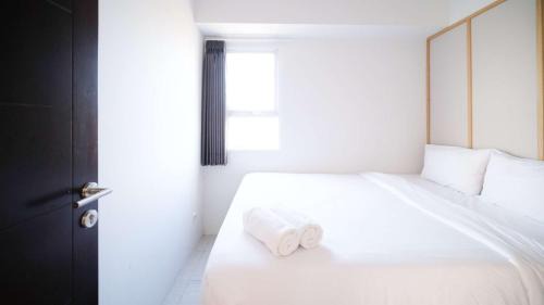 Sidoarjo Apartment | Homey and Comfy 2BR Apartment at Suncity Residence By Travelio