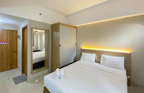 Duren Sawit Apartment | Homey and Well Furnished Studio Gateway Park LRT City Jatibening Apartment By Travelio