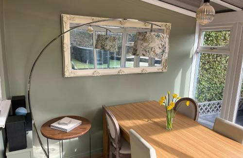 Idle House | Honeybee Cottage, with a log fire & a hot tub.