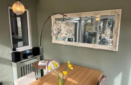 Idle House | Honeybee Cottage, with a log fire & a hot tub.